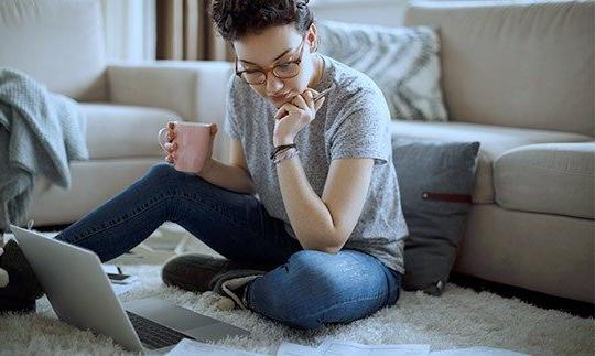 woman conneting to internet for work through anik f2 satellite